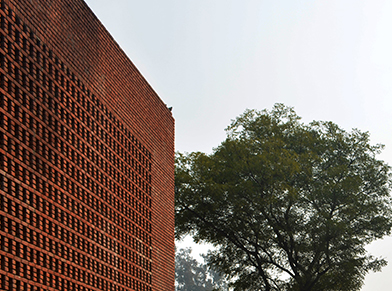 The perforated brick façade