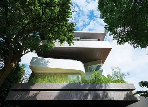 The Façade Appears to be a Stack of Hollowed-out Spaces and Fluid Forms