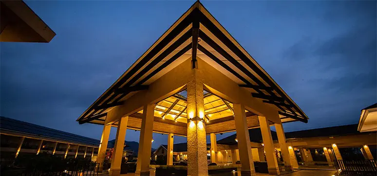 The façade looks impressive at night with its warm glow