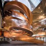 A spiral staircase with copper cladding, copper can be used for cladding in the interiors too (Science Center, Hellerup, Denmark; Architects: CEBRA)