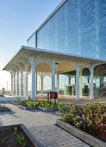 Auric Hall by IMK Architects showcasing fire hydrant near the entry