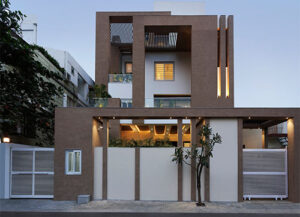 A residential project by Ar. Anurag Pashine, Principal Architects. The asymmetrical façade is dexterously created using skewed & geometric shapes with large windows and a distinctive roof