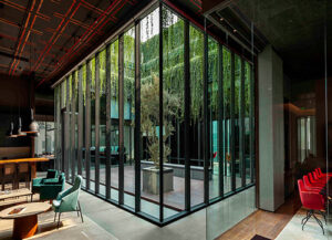 A glass box in cladding material at the East India Hotels Headquarters, Gurugram i
