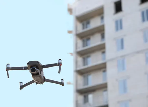 Automated drones check for problems with building façades