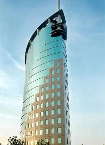 A glass façade building in Gurugram, with no visible, Openable windows