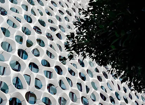 Open façade made of white concrete with Titanium Oxide