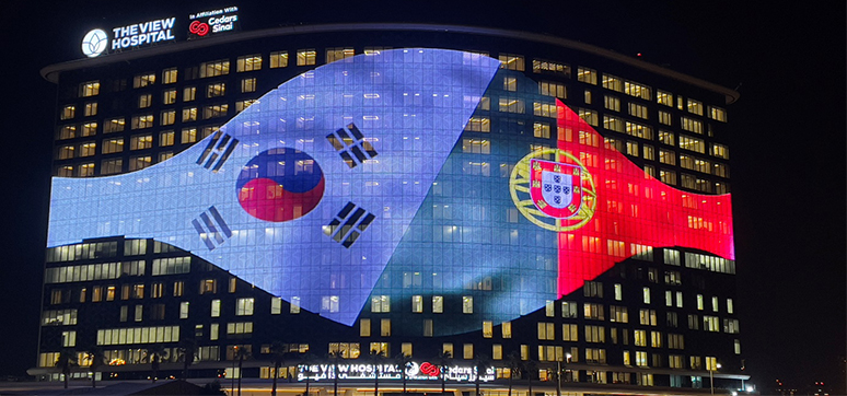 World’s Largest Media Glass Façade Project The View Hospital, Qatar. Media Façade showing the flags of S. Korea and Portugal to commemorate their FIFA World Cup match