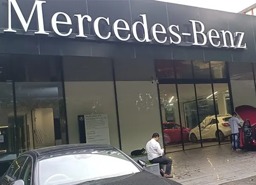 Luxury automobile showroom utilises fully automatic telescopic sliding doors with maintenance-free magnetic levitation technology to get a 4m clear opening to pass the car conveniently