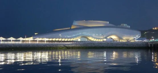 Modern coastal building illuminated