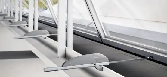 Row of motorized tilt and turn windows with actuators