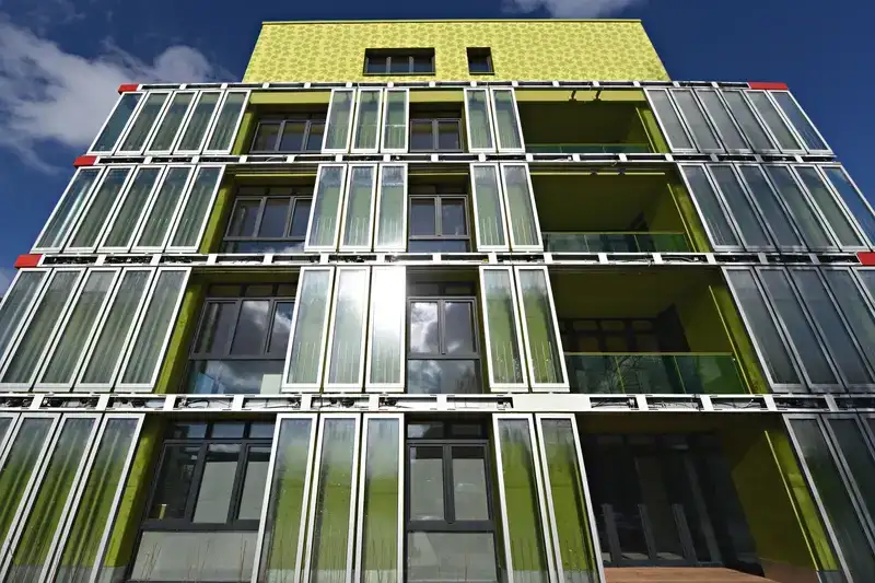 BIQ House, Hamburg - glass photo-bioreactor panels cultivating microalgae to generate biomass and heat, while dynamically shading the building’s east and southwest façades