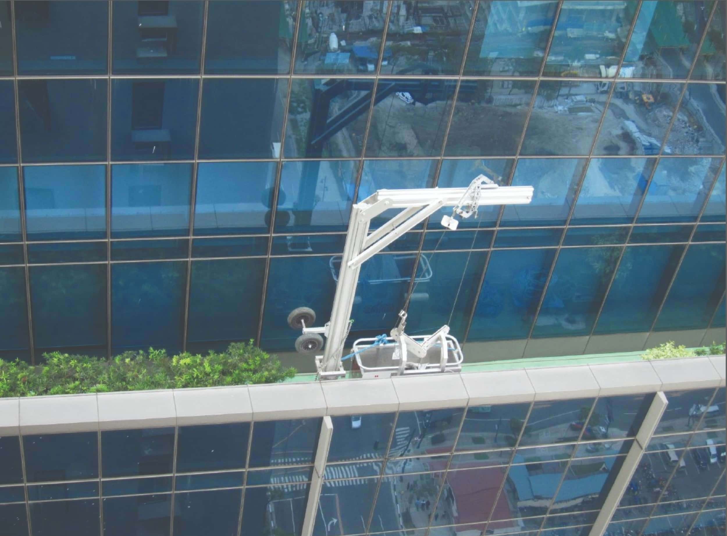 Davits carrying one man cradle to access elevation