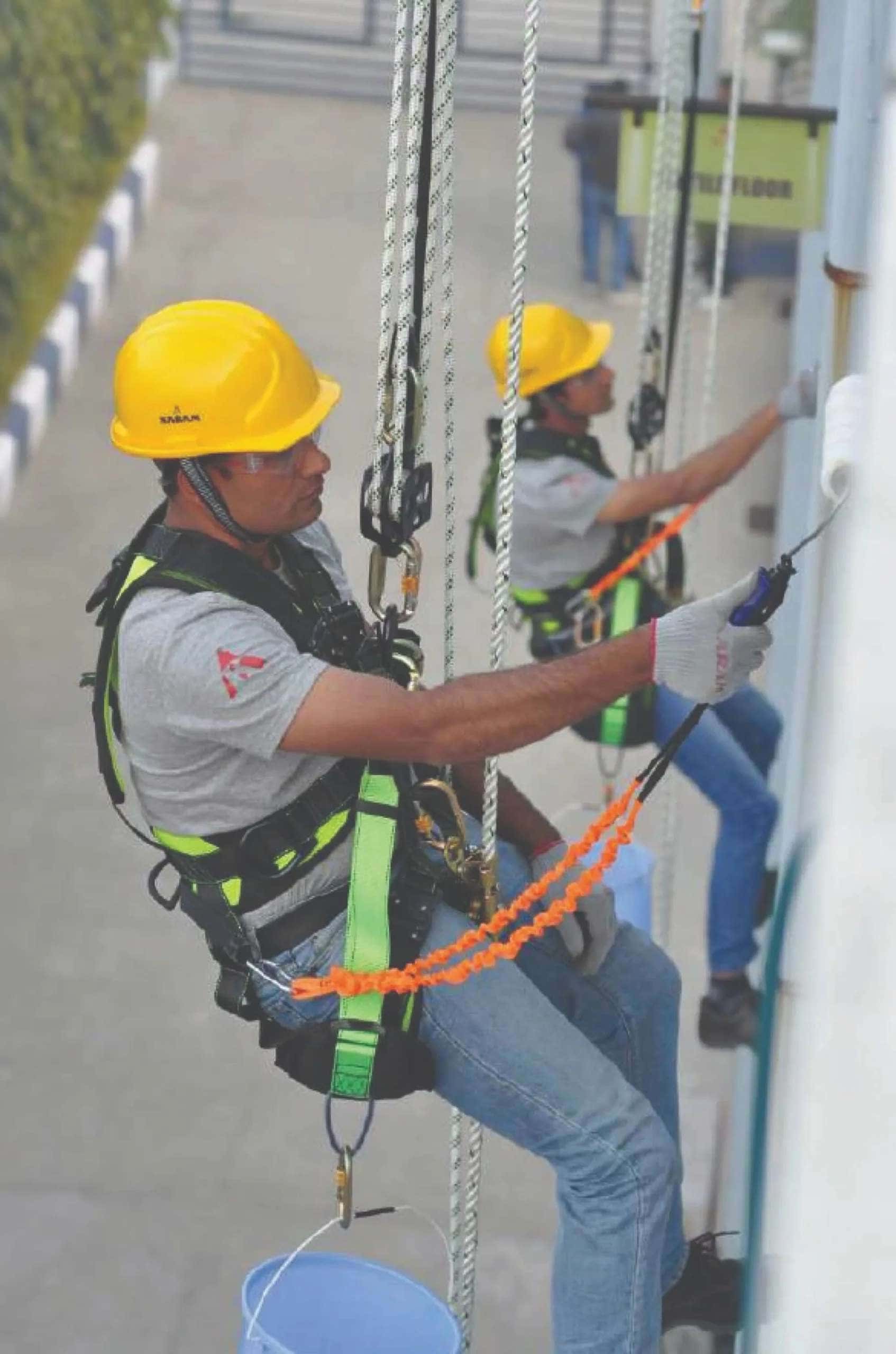 Image Credit – Karam - Rope access technician doing façade maintenance