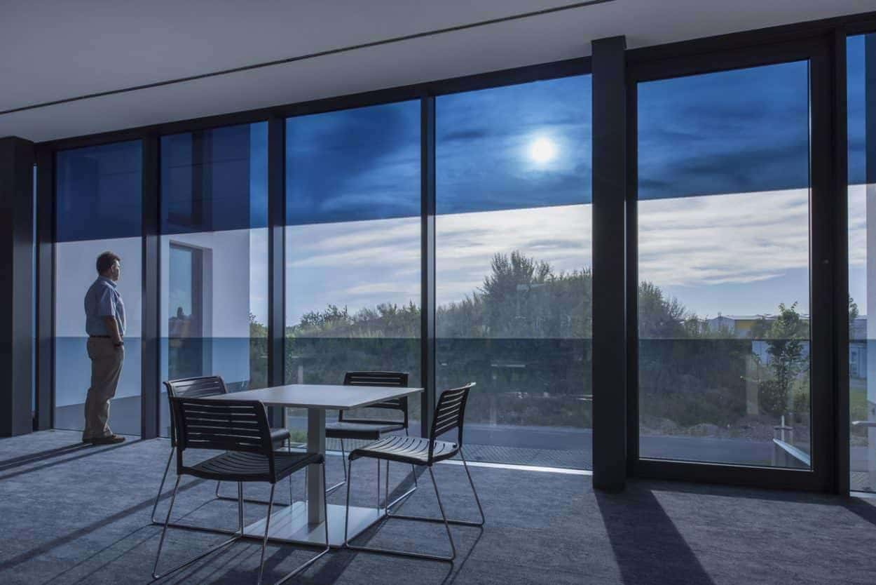 SageGlass electrochromic glazing in action windows transition through clear, light, and medium tint levels to balance daylight, glare, and solar heat, mimicking natural stomatal response for enhanced comfort and efficiency