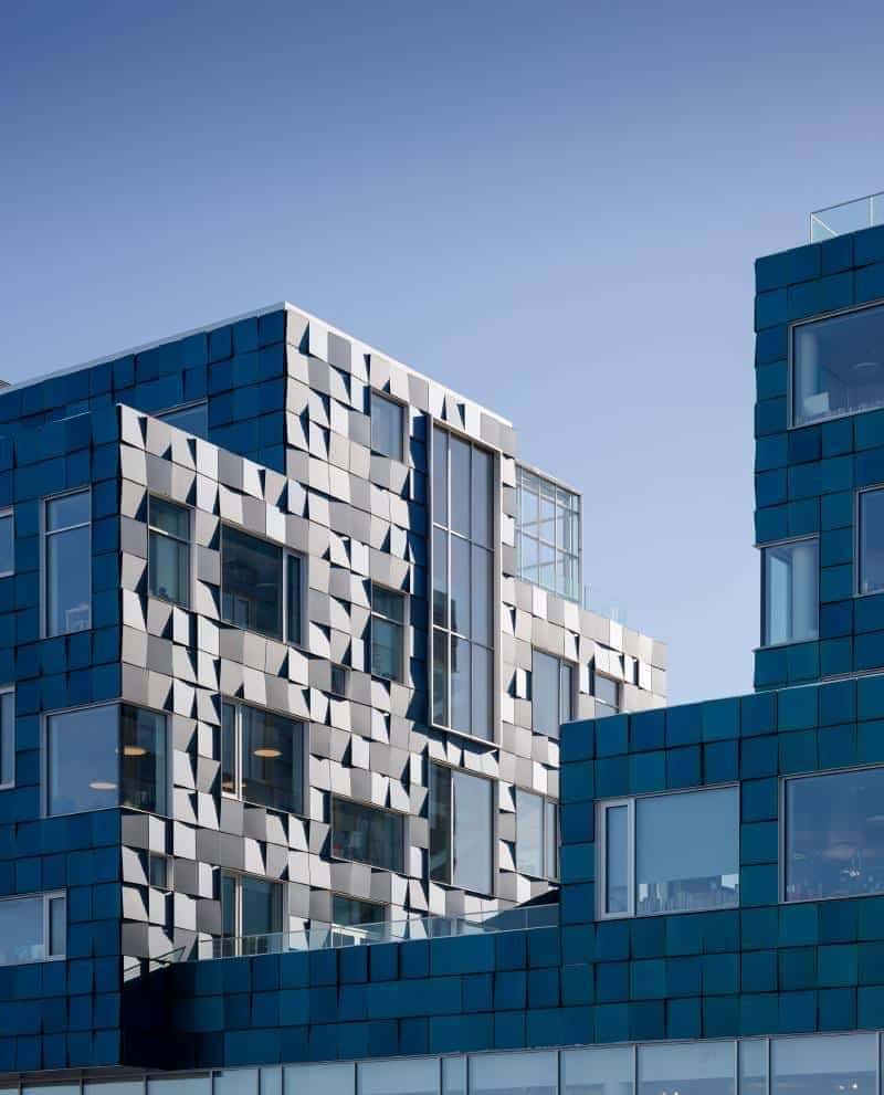 Copenhagen International School Nordhavn (Denmark), architect C.F. Møller. The façade is covered in 12,000 PV each individual panels, suitably angled to give the effect. The panels supply over 50% of the school ́s annual electricity consumption