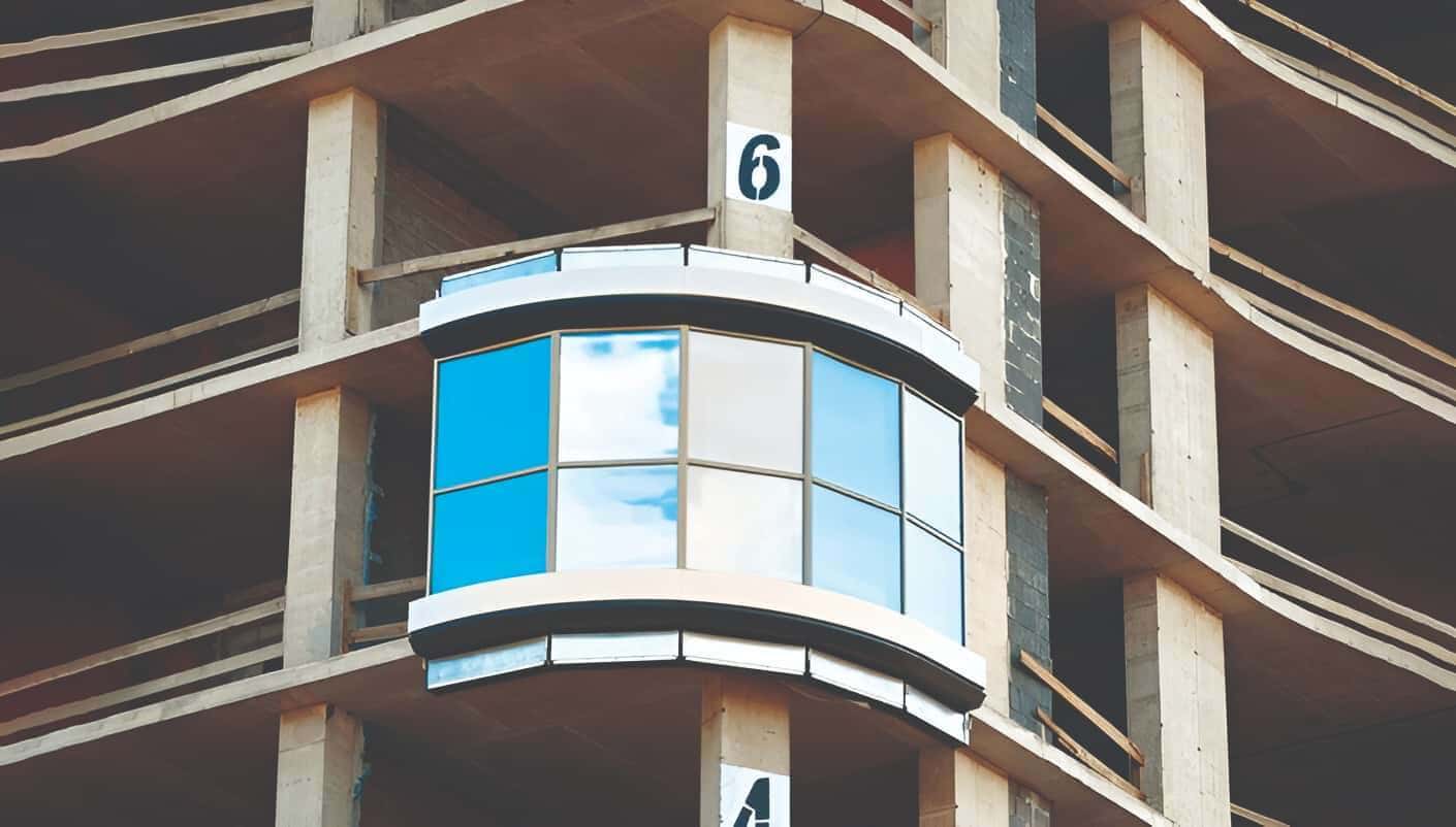 Unitised systems arrive at the site as fully prefabricated panels - glass and frame already assembled - ready to be hoisted and anchored