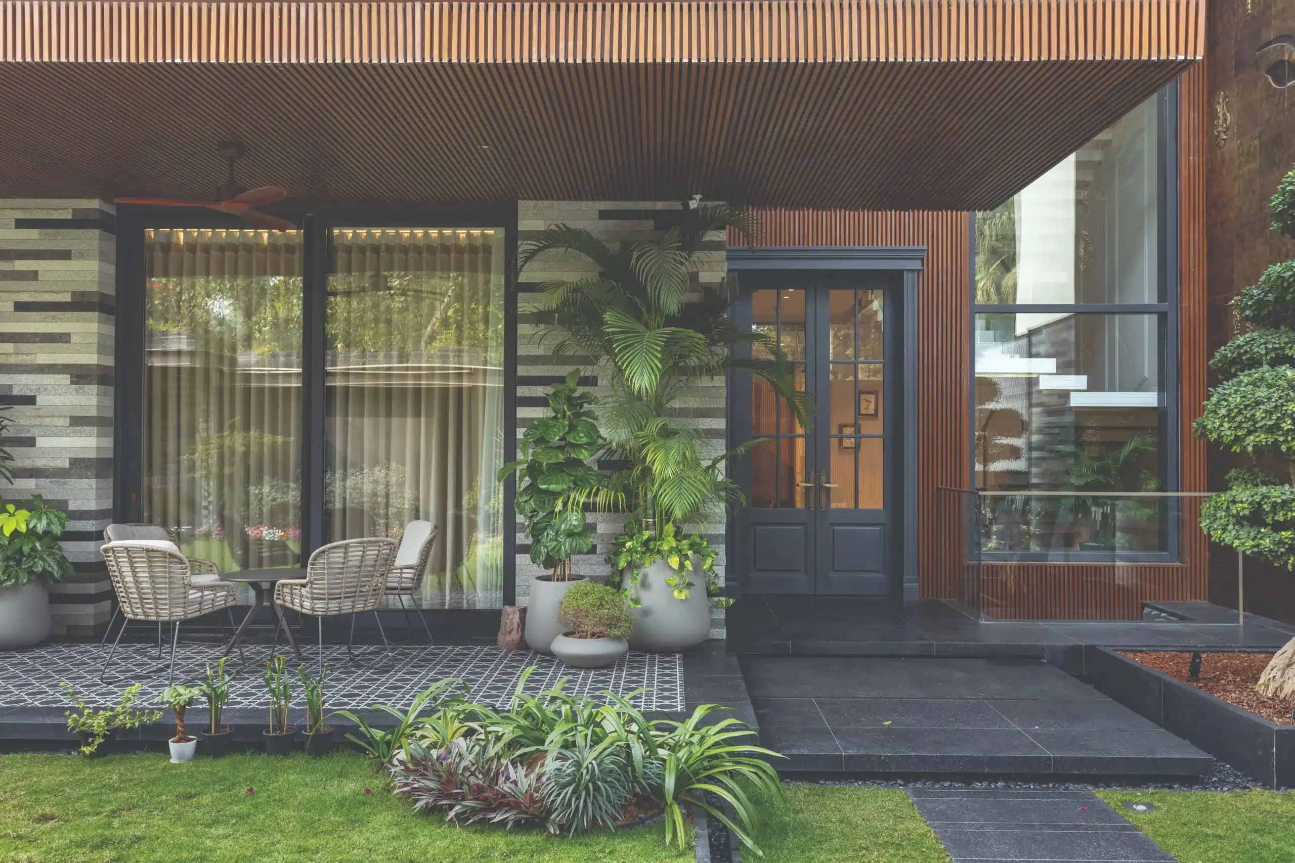 Light and shadow shift through the day, and every door and window open to a tranquil garden vista