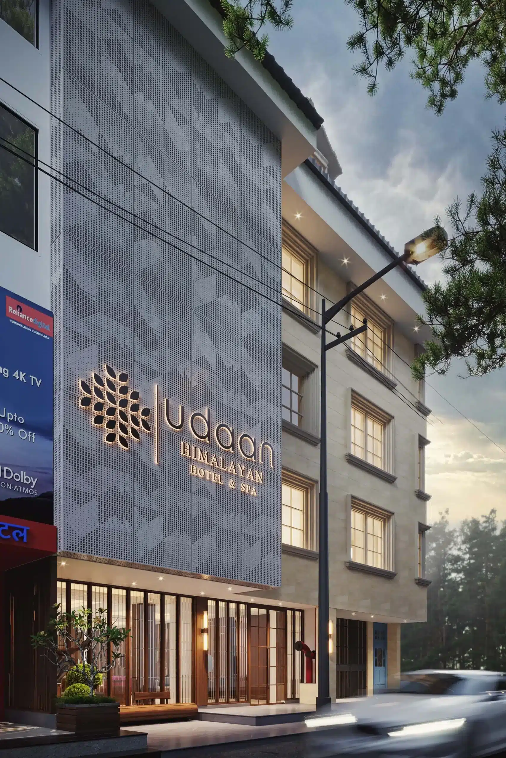 The illuminated metal mesh façade turns the building into a subtle urban landmark after sunset. Soft backlighting highlights the pattern, showing how lighting and material together enhance architectural character (Image Credit - 6Hues Architecture Studio)