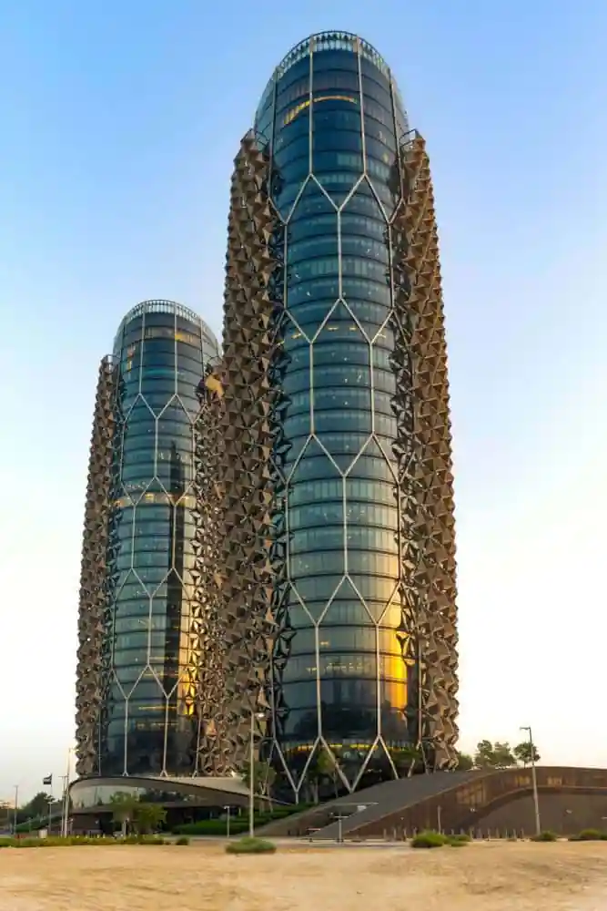 Al Bahar Towers, Abu Dhabi - These towers feature a dynamic façade made of smart glass panels that open and close in response to the sun’s movement