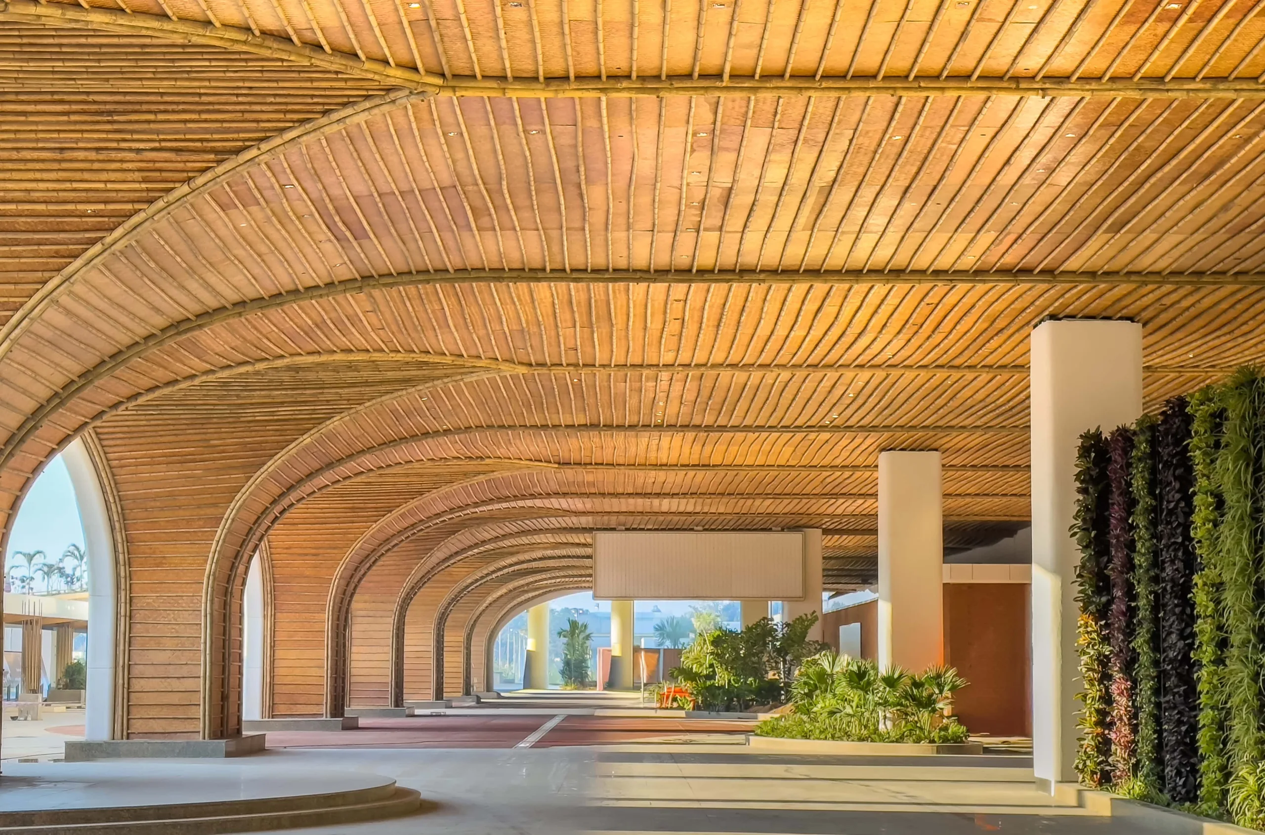 The façade detailing incorporates deep extruded aluminium fins and louvre systems that act as passive shading devices, strategically placed based on solar path analysis