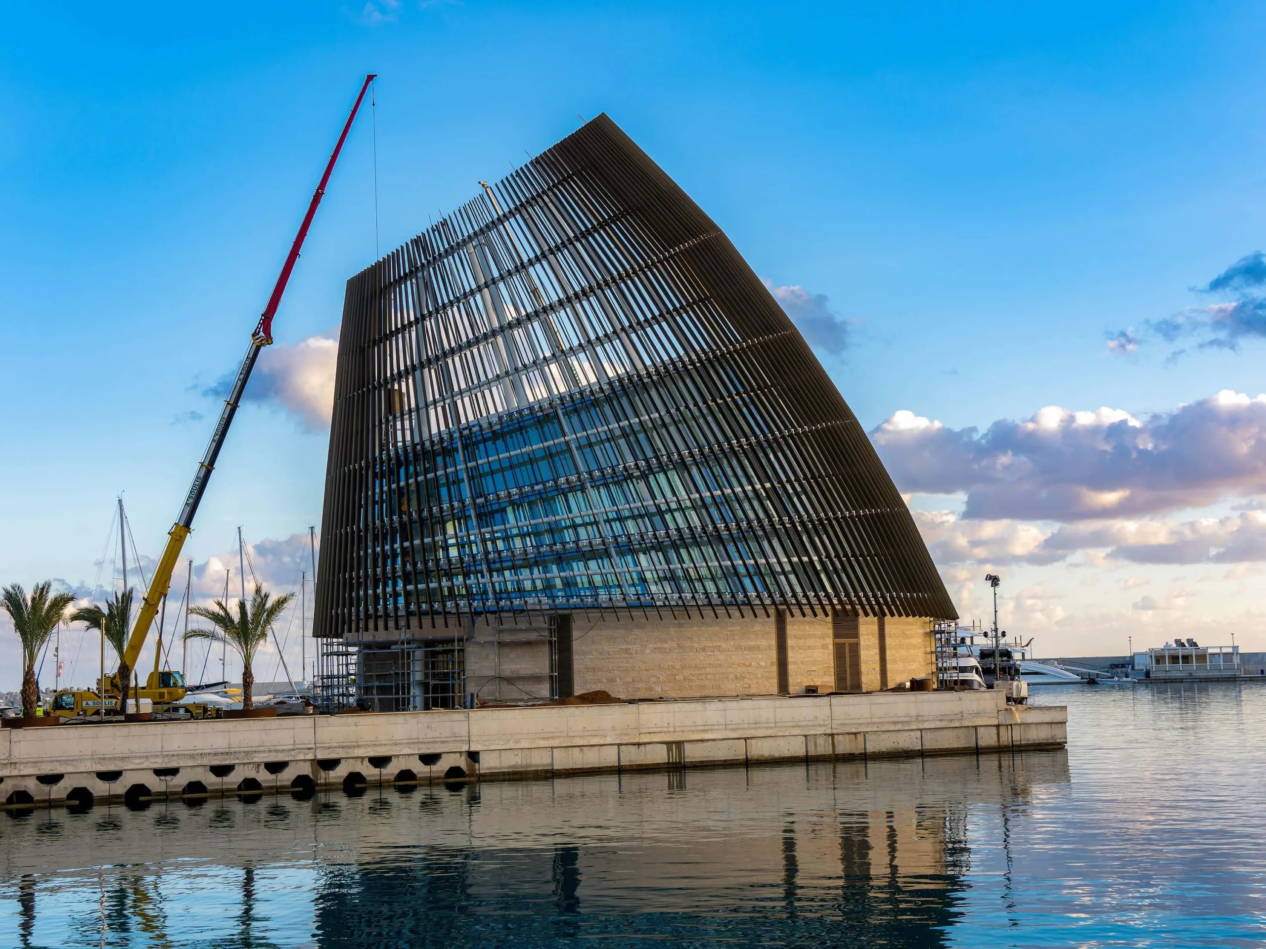 The metal building shell is ideally complemented by the specially constructed aluminium curtain walls (Image Credit – Alumil India)