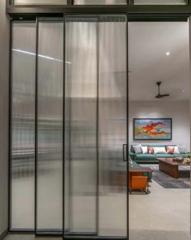 Visual connectivity between spaces enhanced by a large internal window allowing light and openness