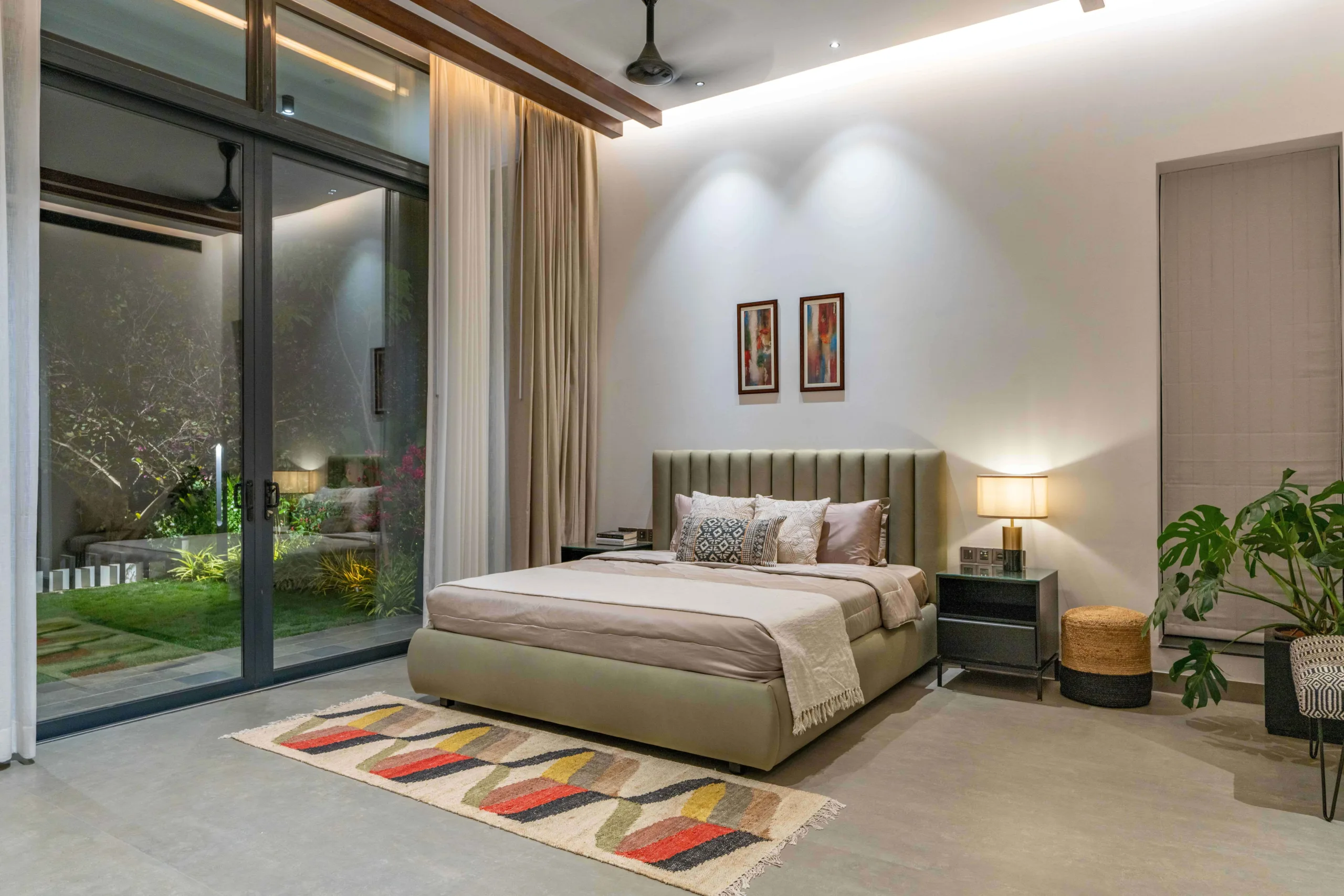 Wooden rafters in bedrooms adding warmth and reinforcing the indoor–outdoor design language