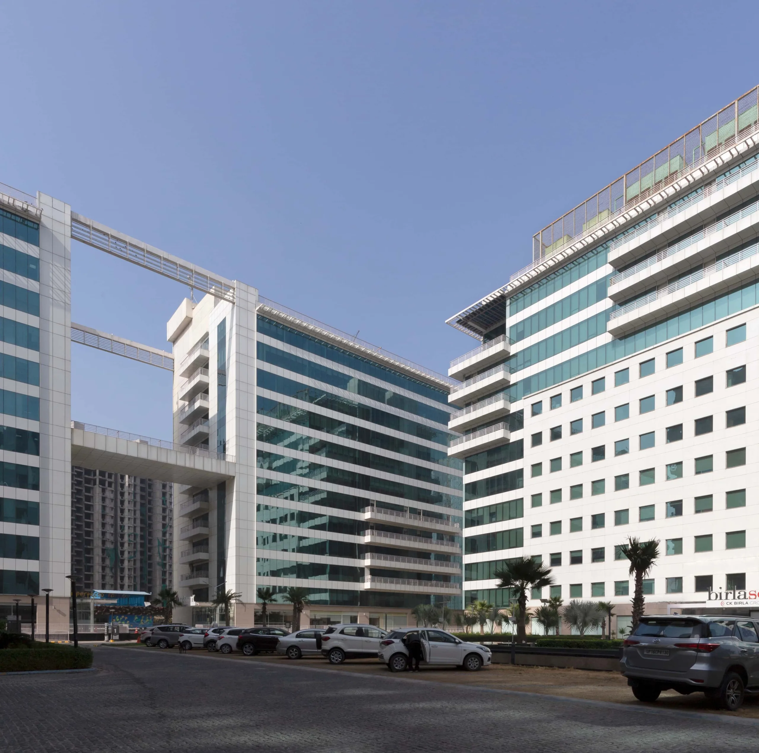 High-performance commercial façade with orientation-based fenestration strategy at Assotech Business Cresterra