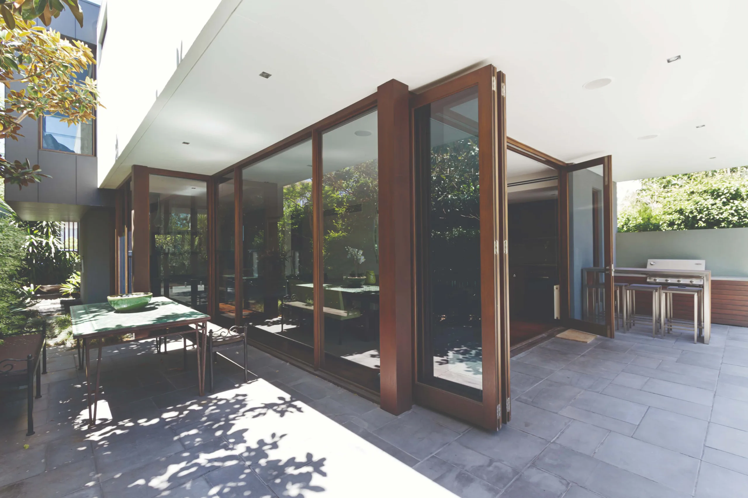Large format uPVC Slide & Fold Doors seamlessly connecting indoor and outdoor spaces, while maximizing natural light penetration