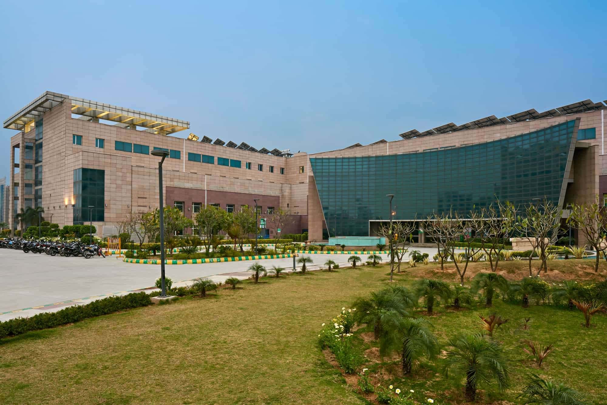 Orientation-specific façade design at GIMS, Greater Noida, integrating controlled glazing, perforated shading elements, and solid-void modulation to enhance daylight while managing heat gain