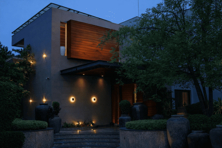 Dusk lighting reveals the façade as a sequence of layers