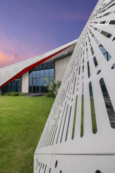 Parametric Aluminium Panels: Standardised modular aluminium panels with digitally generated perforation patterns combine fabrication efficiency with architectural expression.